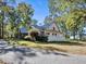 Brick home with metal roof, showcasing a side view at 3530 Dahlonega Hwy, Cumming, GA 30028