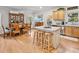 Bright kitchen featuring an island, hardwood floors, and ample cabinetry at 3530 Dahlonega Hwy, Cumming, GA 30028