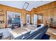Bright sunroom with multiple seating areas and access to the outdoors at 3530 Dahlonega Hwy, Cumming, GA 30028