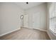 Bedroom featuring luxury vinyl plank flooring, a window, and two closets at 6329 Edgewater Cv, Fairburn, GA 30213