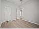 Bedroom with luxury vinyl plank flooring, a ceiling fan, and two closets at 6329 Edgewater Cv, Fairburn, GA 30213
