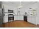 Well-appointed kitchen with white cabinetry, stainless steel appliances, and granite countertops at 6329 Edgewater Cv, Fairburn, GA 30213