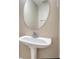 Powder room featuring single sink on pedestal at 6693 Villa Ct # 6693, Lithonia, GA 30038