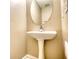 Bathroom with pedestal sink, oval mirror, and neutral walls at 6693 Villa Ct # 6693, Lithonia, GA 30038