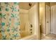 Bathroom featuring a tub/shower with decorative curtain and tiled floor at 6693 Villa Ct # 6693, Lithonia, GA 30038