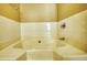Bathroom featuring a tub with tile surround and chrome fixtures at 6693 Villa Ct # 6693, Lithonia, GA 30038