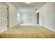 Bright, spacious bedroom with carpet flooring and neutral paint, ready for customization at 6693 Villa Ct # 6693, Lithonia, GA 30038