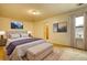Bedroom featuring stylish decor, natural light, and a comfortable bed at 6693 Villa Ct # 6693, Lithonia, GA 30038