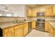 Updated kitchen with wood cabinets, stainless steel appliances, and neutral countertops at 6693 Villa Ct # 6693, Lithonia, GA 30038
