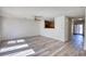 Open concept living room featuring hardwood floors and bright natural light at 6693 Villa Ct # 6693, Lithonia, GA 30038