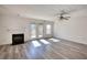 Living room with fireplace and access to the backyard through glass doors at 6693 Villa Ct # 6693, Lithonia, GA 30038