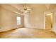Spacious main bedroom features a ceiling fan, large window and access to ensuite at 6693 Villa Ct # 6693, Lithonia, GA 30038