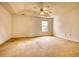 Spacious main bedroom features a ceiling fan and a large window at 6693 Villa Ct # 6693, Lithonia, GA 30038