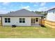 Spacious backyard with a well-maintained lawn and white siding at 134 Oakchase Park Ln, Hampton, GA 30228