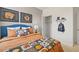 Bedroom features a bed with a sports-themed comforter and a closet at 134 Oakchase Park Ln, Hampton, GA 30228
