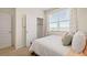 Bedroom features a bed with decorative pillows and window at 134 Oakchase Park Ln, Hampton, GA 30228