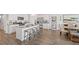 Contemporary kitchen featuring granite countertops, an island with seating, and stainless steel appliances at 134 Oakchase Park Ln, Hampton, GA 30228