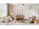 Cozy living room with stylish furnishings, a wooden cabinet, and natural light at 134 Oakchase Park Ln, Hampton, GA 30228
