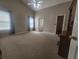 Spacious bedroom with high ceilings, neutral walls, and ample natural light from multiple windows at 7030 Valley Landing Ct, Cumming, GA 30041