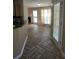 Open concept: tiled floor leading to living room featuring a fireplace and many windows dressed with modern curtains at 7030 Valley Landing Ct, Cumming, GA 30041