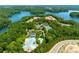 An aerial view showcasing the community pool, tennis courts, and lake access at 306 Mountain Laurel Walk, Canton, GA 30114