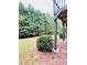 Well-maintained backyard with level lawn and mature trees, offering privacy and shade at 306 Mountain Laurel Walk, Canton, GA 30114