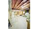 Unfinished basement features wood framing, exposed insulation, and concrete flooring at 306 Mountain Laurel Walk, Canton, GA 30114