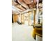 Unfinished basement features wood framing, exposed insulation, and concrete flooring at 306 Mountain Laurel Walk, Canton, GA 30114