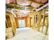 Unfinished basement features wood framing, exposed insulation, and concrete flooring at 306 Mountain Laurel Walk, Canton, GA 30114