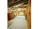 Unfinished basement features wood framing, exposed insulation, and concrete flooring at 306 Mountain Laurel Walk, Canton, GA 30114