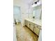 Bathroom with vanity, cabinets and neutral tile flooring at 306 Mountain Laurel Walk, Canton, GA 30114