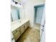 Bathroom with vanity, cabinets, and neutral flooring at 306 Mountain Laurel Walk, Canton, GA 30114