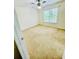 Bedroom with carpeted floor, a ceiling fan and a window at 306 Mountain Laurel Walk, Canton, GA 30114