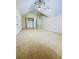 Spacious carpeted bedroom featuring a ceiling fan and large walk-in closet at 306 Mountain Laurel Walk, Canton, GA 30114