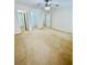 Carpeted bedroom with doorways to bathroom and closet, featuring ceiling fan at 306 Mountain Laurel Walk, Canton, GA 30114