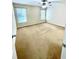 Bright bedroom featuring two windows for natural light and a ceiling fan at 306 Mountain Laurel Walk, Canton, GA 30114