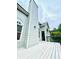 Exterior deck showcasing a chimney and views of the mature tree line at 306 Mountain Laurel Walk, Canton, GA 30114