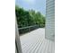 Outdoor deck with grey painted wood and a view of mature trees at 306 Mountain Laurel Walk, Canton, GA 30114