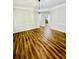 Dining room with hardwood floors, light-colored walls, and modern chandelier at 306 Mountain Laurel Walk, Canton, GA 30114