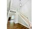 Elegant foyer featuring hardwood floors, a staircase, and a decorative light fixture at 306 Mountain Laurel Walk, Canton, GA 30114