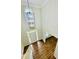 Inviting foyer with a view of the front door and living spaces, showcasing an elegant light fixture at 306 Mountain Laurel Walk, Canton, GA 30114