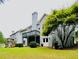 Back exterior showcasing the spacious backyard with multi-level decks, ideal for outdoor entertaining at 306 Mountain Laurel Walk, Canton, GA 30114