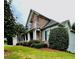 Charming two-story home with a stone facade and a well-maintained front yard at 306 Mountain Laurel Walk, Canton, GA 30114