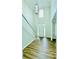 Grand foyer with hardwood floors, a statement pendant light, and staircase at 306 Mountain Laurel Walk, Canton, GA 30114