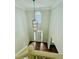 Bright, two story foyer features a statement pendant light and hardwood floors at 306 Mountain Laurel Walk, Canton, GA 30114