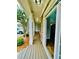 Inviting front porch showcasing stone accents, wood flooring, and an open doorway at 306 Mountain Laurel Walk, Canton, GA 30114