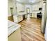 Bright kitchen featuring ample cabinetry, stainless steel appliances, and wood flooring at 306 Mountain Laurel Walk, Canton, GA 30114