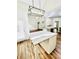Kitchen island with granite countertop and modern pendant lighting at 306 Mountain Laurel Walk, Canton, GA 30114