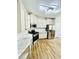 Bright kitchen featuring white cabinets, stainless steel appliances, granite countertops, and custom backsplash at 306 Mountain Laurel Walk, Canton, GA 30114