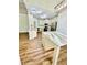 Open kitchen featuring stainless steel appliances, marble countertops, and hardwood floors at 306 Mountain Laurel Walk, Canton, GA 30114